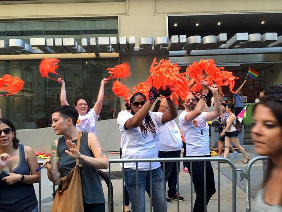 Cheerleaders greet marchers from the sidelines.