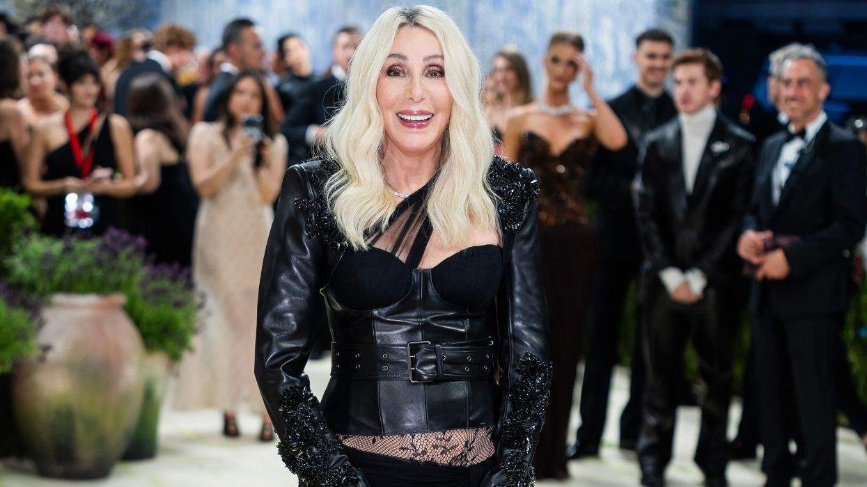 cher at the met gala in a black leather and lace outfit