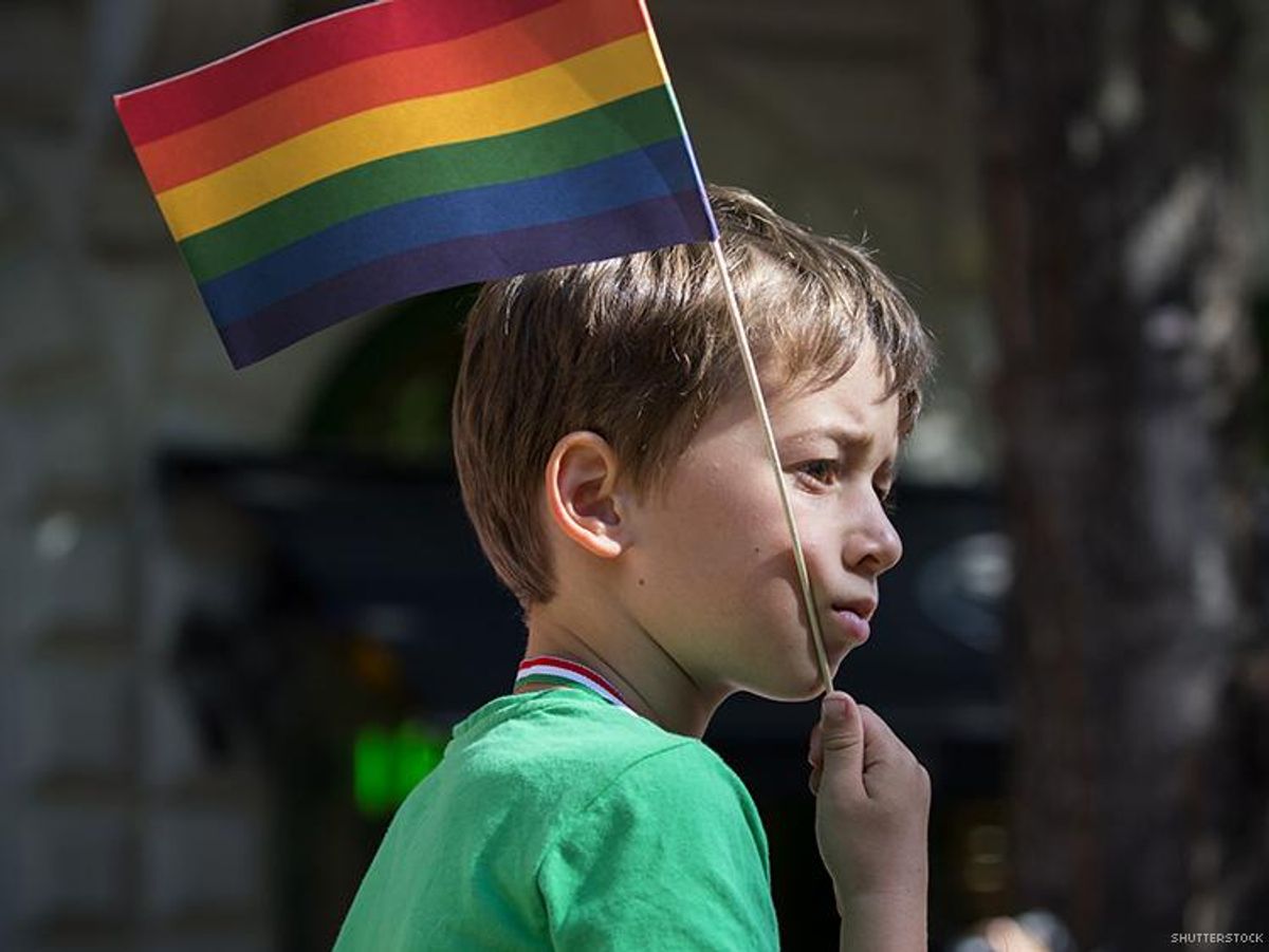 Child with rainbow flag