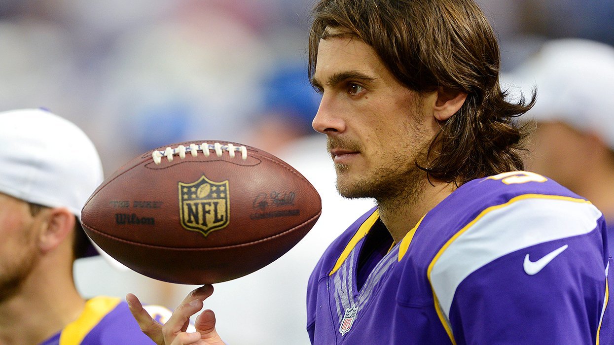 Chris Kluwe punter Minnesota Vikings watches from the sidelines in uniform during an NFL game 2012