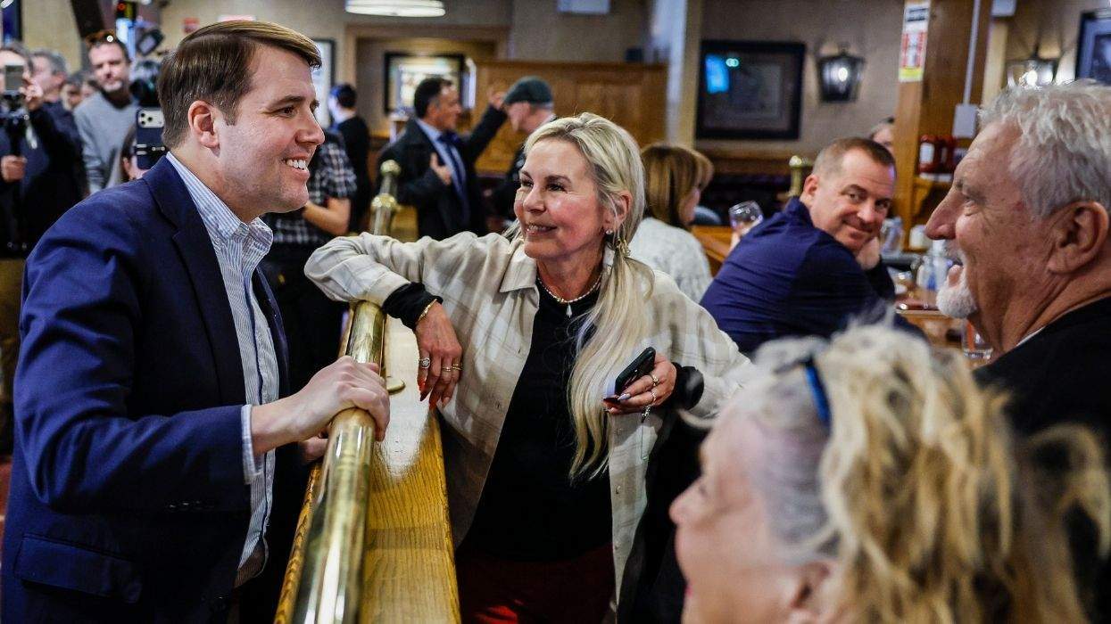chris pappas speaking to people at a diner