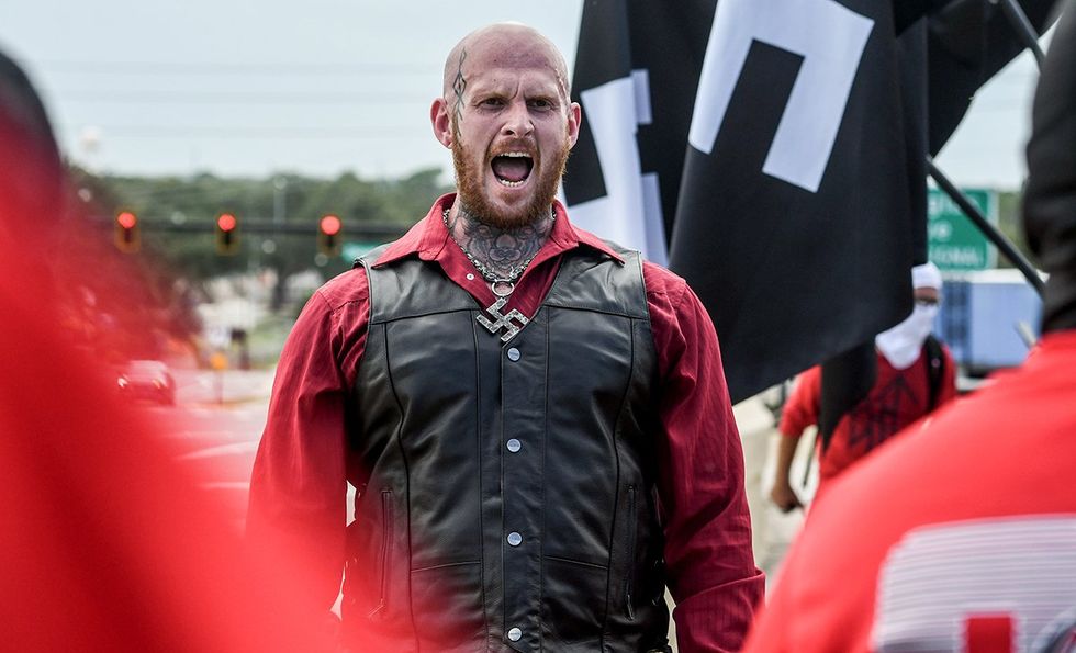 Christopher Pohlhaus curbside rally Orlando Florida Blood Tribe and Goyim Defense League Neo Nazi leader twisted cross necklace