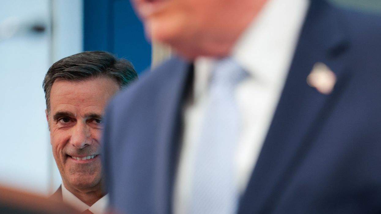 cia director john ratcliffe looks over donald trump's shoulder