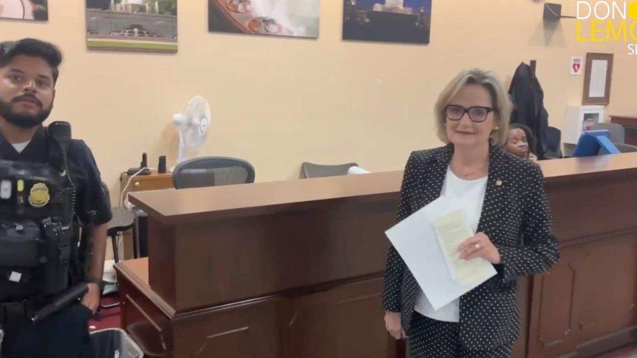 cindy hyde-smith with a capitol police officer