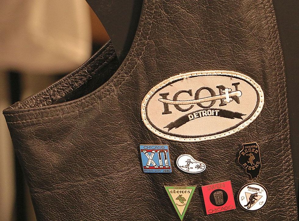 Close-up detail of leather vest belonging to Mr. ONYX Leather 1998 title holder Mufasa Ali. The vest displays years worth of club pins and run pins, including many from ONYX.