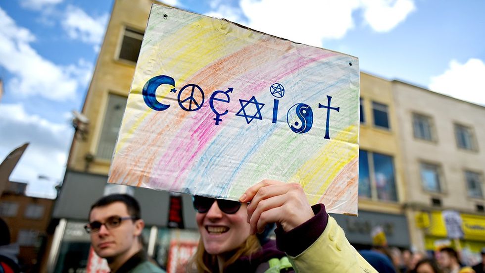 Coexist rainbow world religion symbols LGBTQ pride march