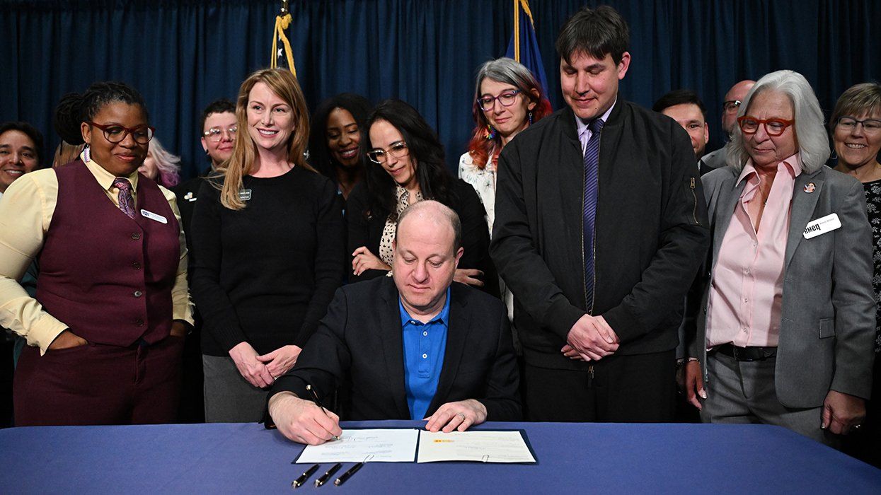 Colorado governor Jared Polis signing SB25-014 entitled Protecting the Freedom to Marry into law