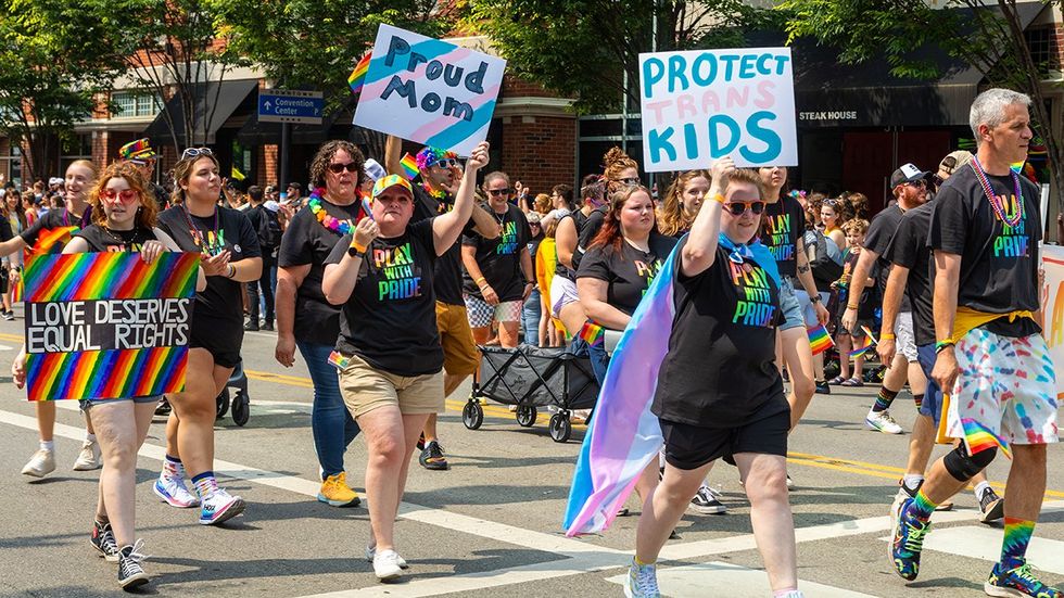 Columbus Ohio LGBTQ pride parade protect trans kids sign