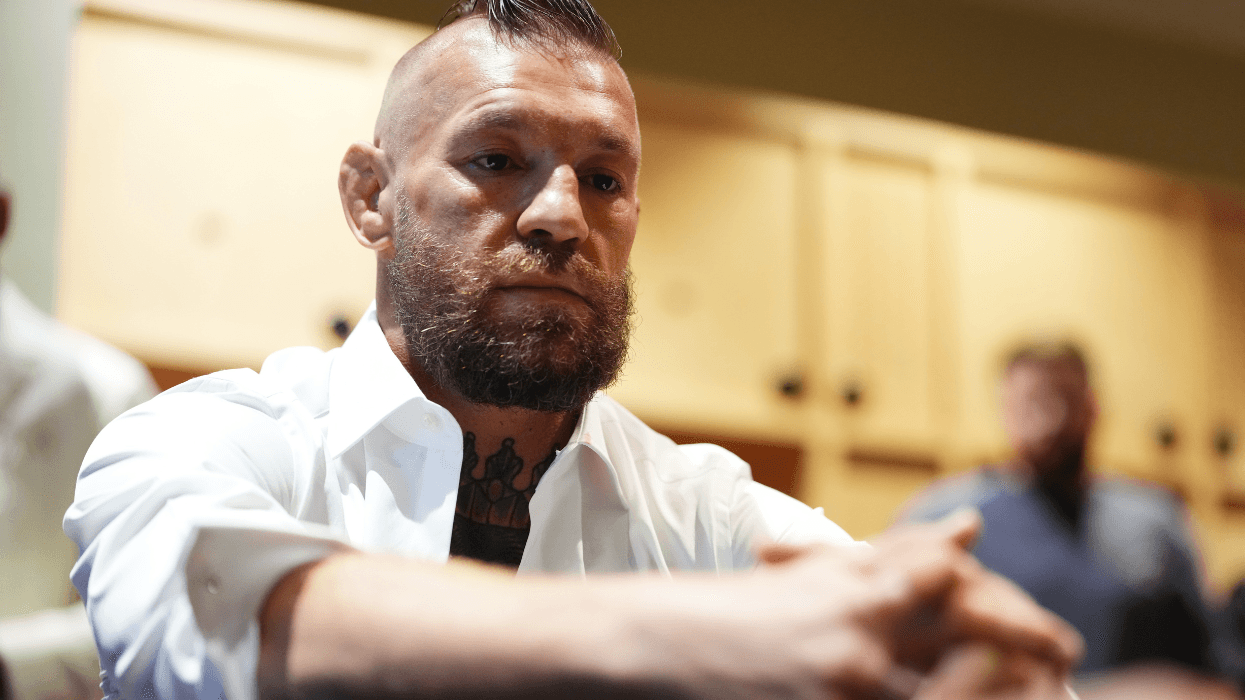 Conor McGregor with his hands folded in front of him