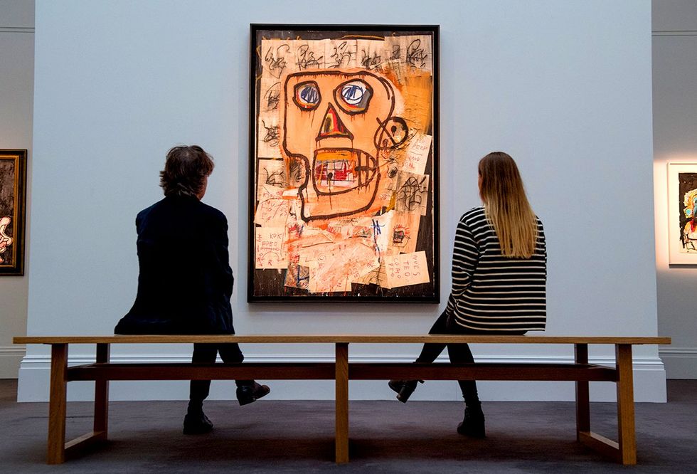 contemplating painting Jean-Michel Basquiat Sothebys Auction House London England