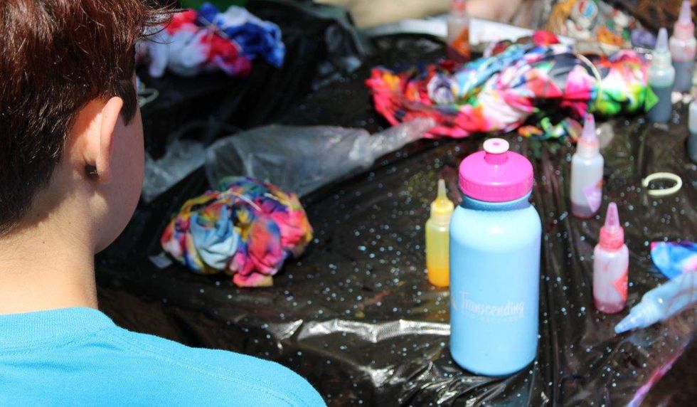 craft table with glue and glitter