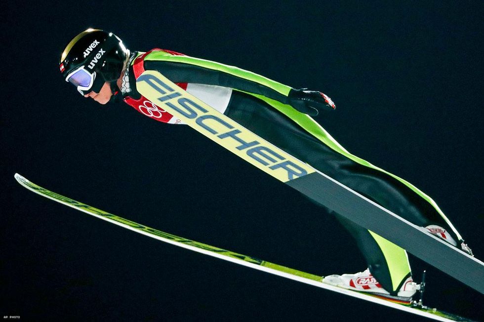 Daniela Iraschko-Stolz, of Austria, soars through the air during the women's normal hill individual ski jumping competition
