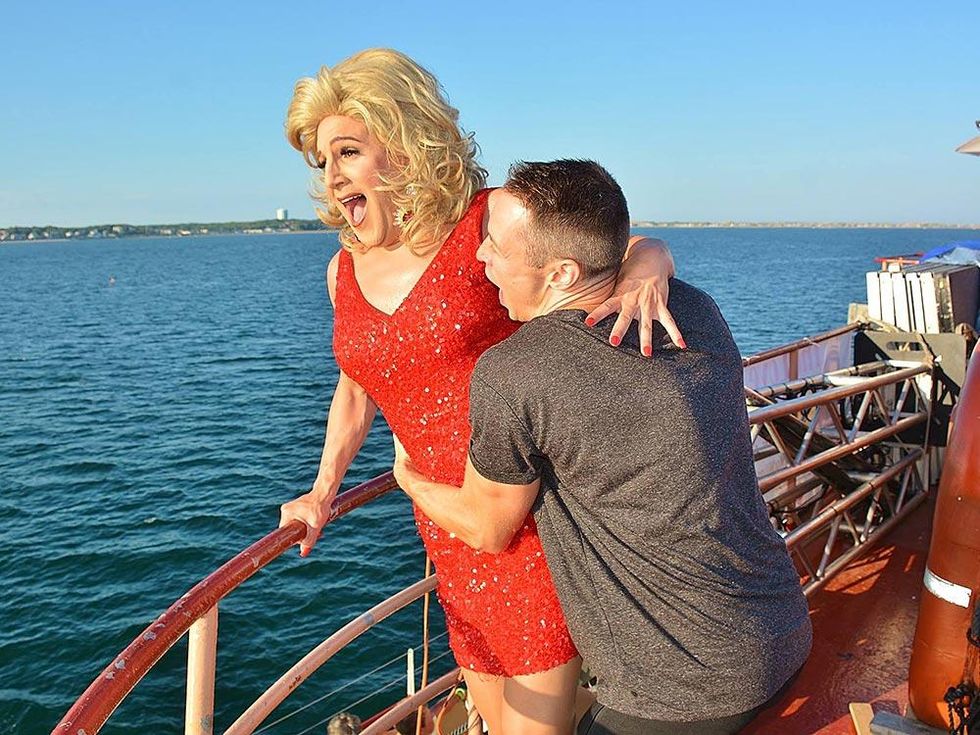 Davey Wavey is either rescuing Haley Star, or throwing her overboard.