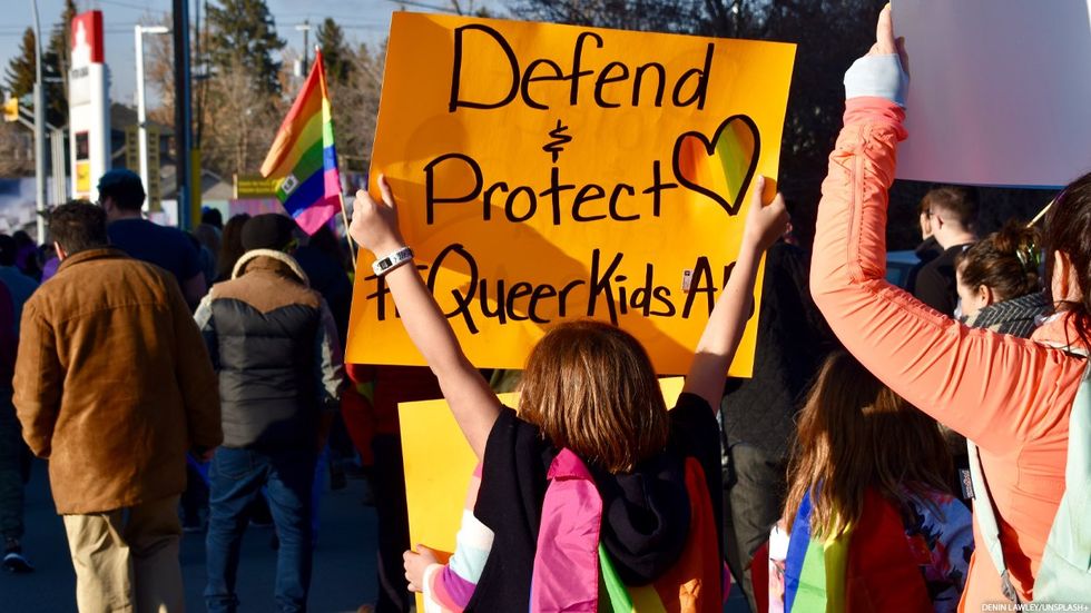 Defend queer kids sign