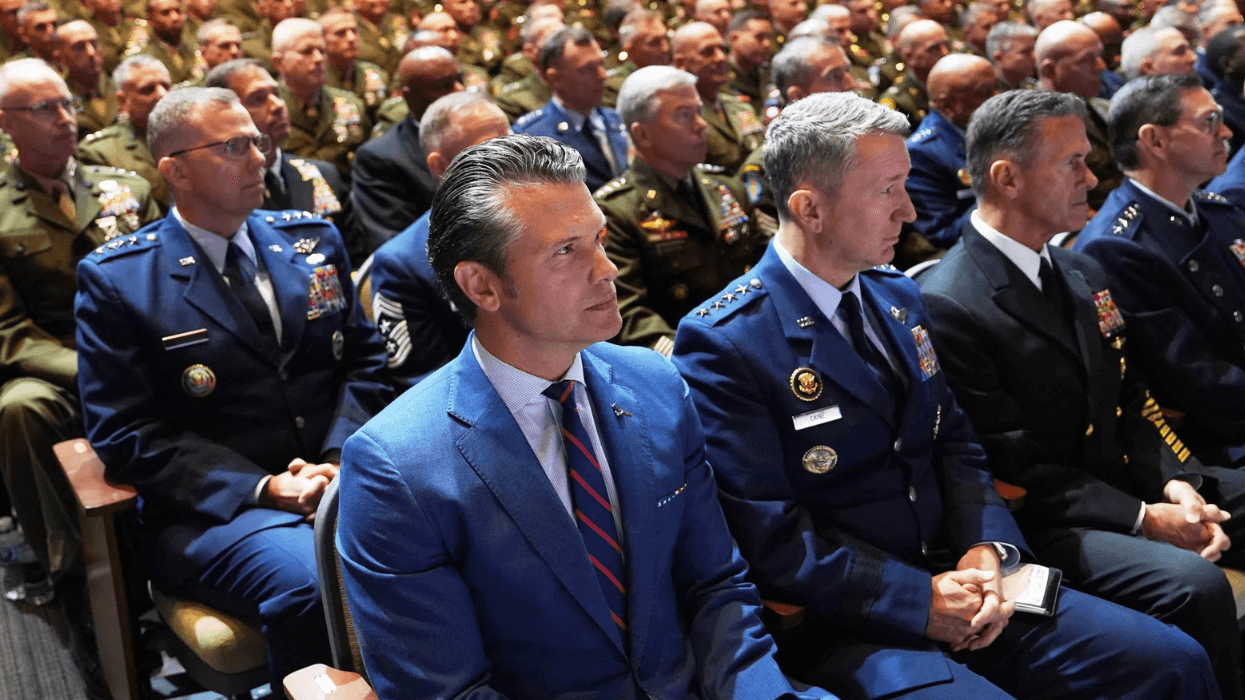 Defense Secretary Pete Hegseth, front left, and senior U.S. military leaders listen to President Donald Trump speak at Marine Corps Base Quantico in Virginia in 2025.