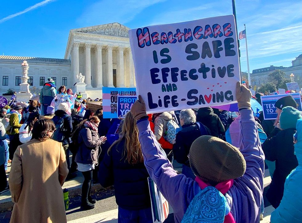 Demonstrators at the Supreme Court building during the gender-affirming care case