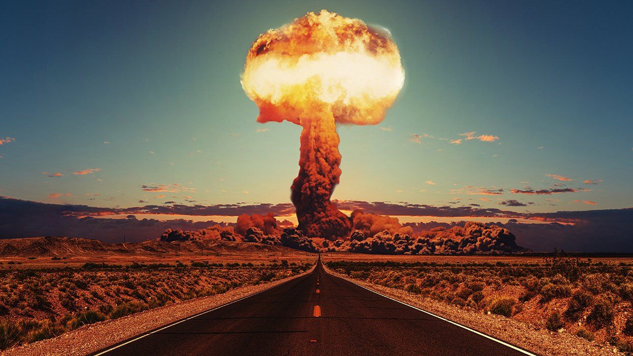 desert road leading to nuclear bomb explosion