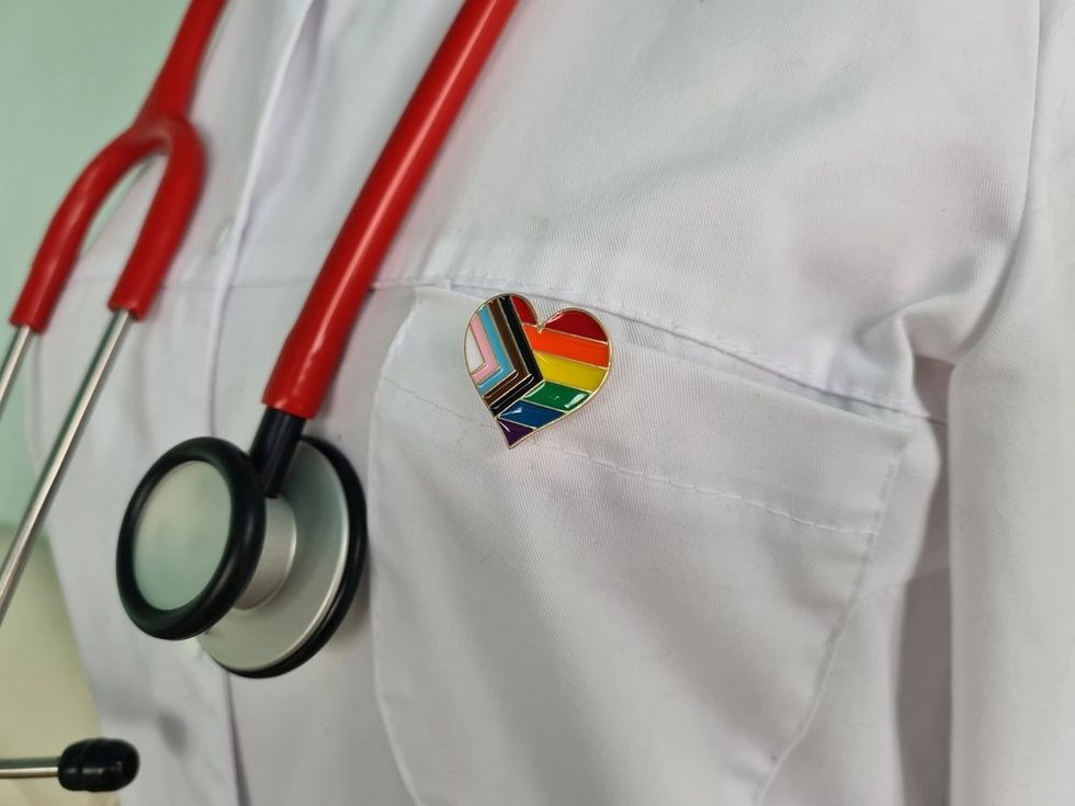 Doctor with LGBTQ+ Pride pin