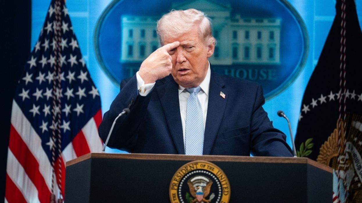 donald trump gestures to his head