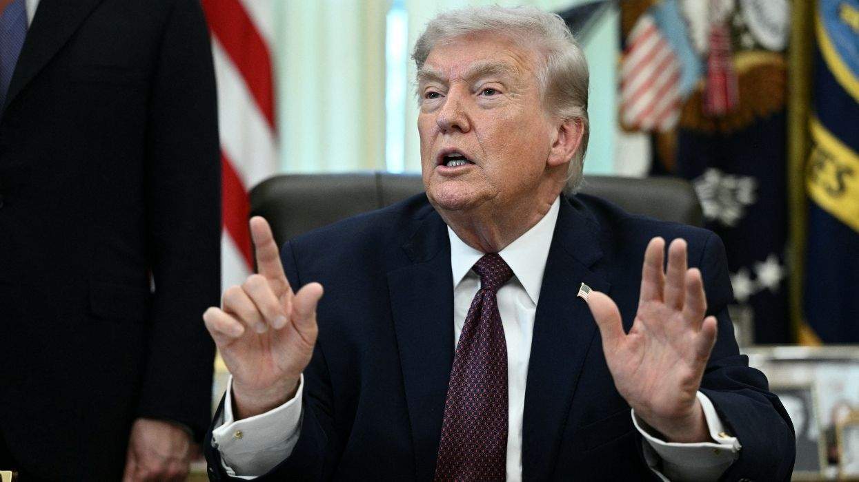 donald trump gesturing in the oval office