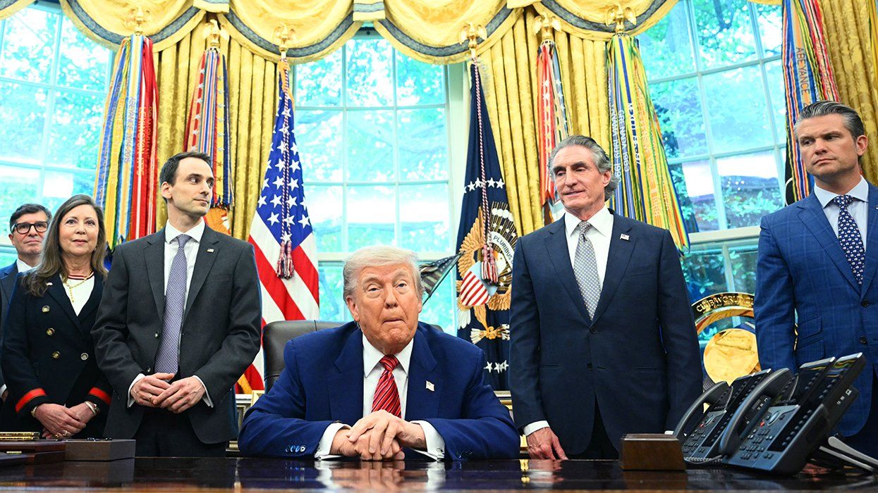Donald Trump oval office desk surrounded by cabinet and administration members