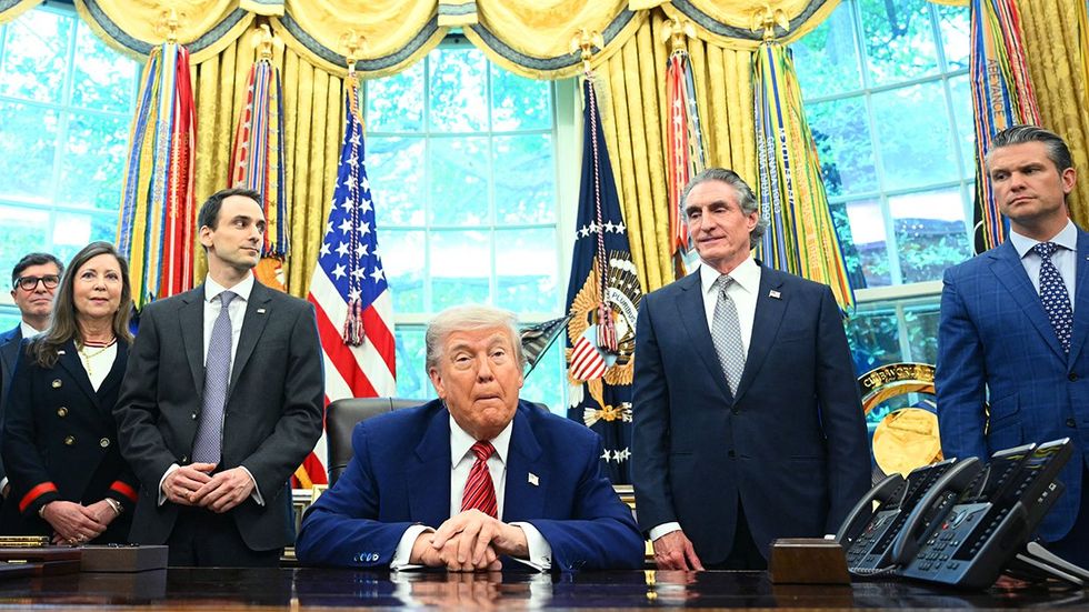 Donald Trump oval office desk surrounded by cabinet and administration members