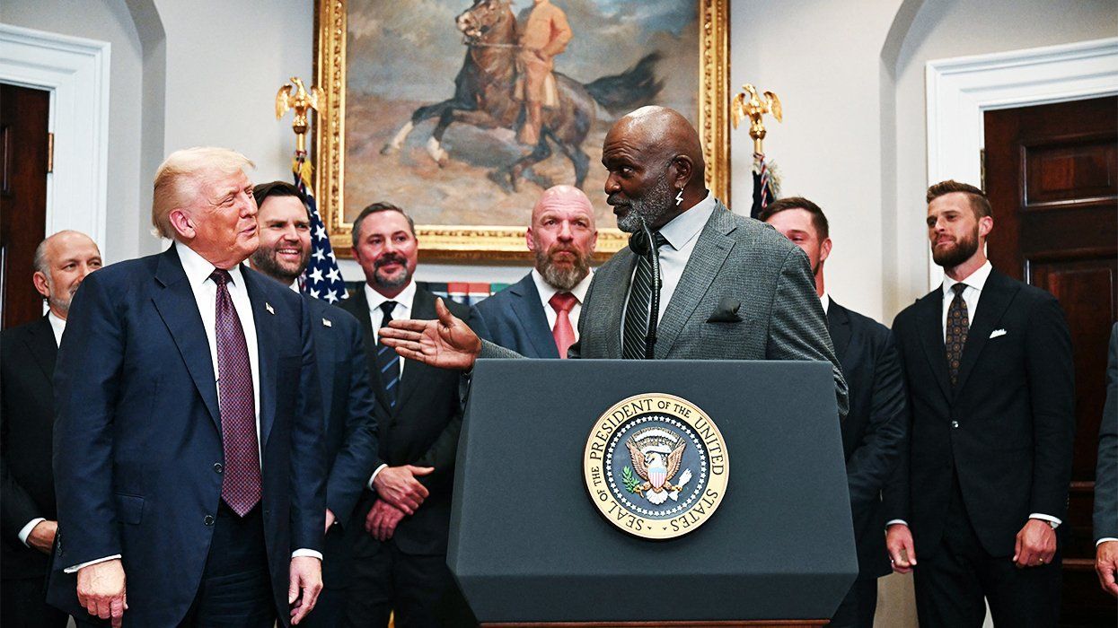 Donald Trump surrounded by men, including former New York Giants player and sex offender Lawrence Taylor