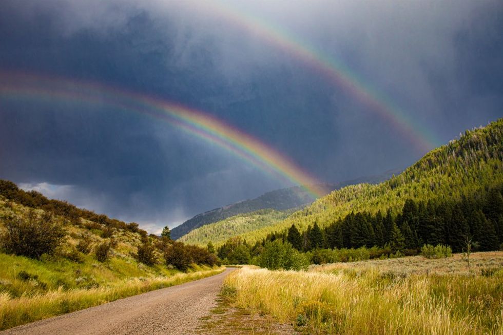 Double rainbow against a black sky in Wyoming