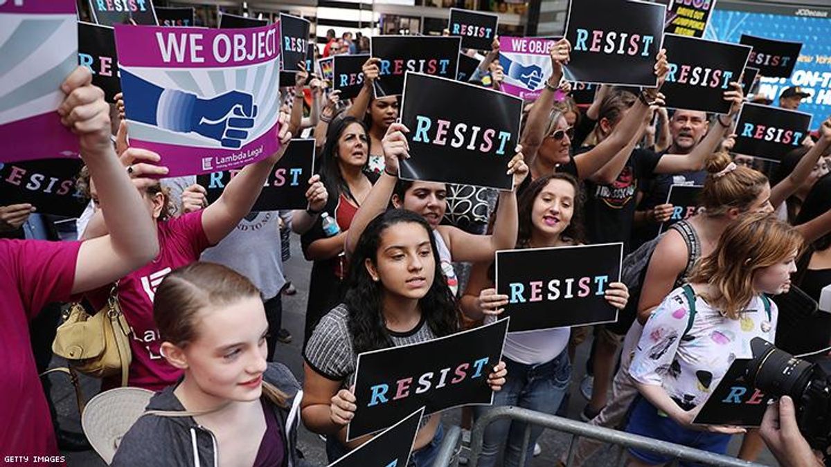 Dozens of protesters gather in Times Square near a military recruitment center to show their anger at President Donald Trump's decision to reinstate a ban on transgender individuals from serving in the military 