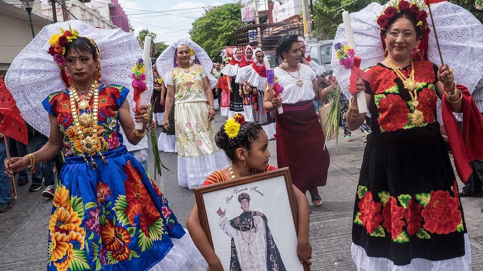 Dressed in traditional Zapotec attire, muxes in Juchitán, Mexico, partake in a parade for the annual "Vela de las Intrépidas" in 2016.