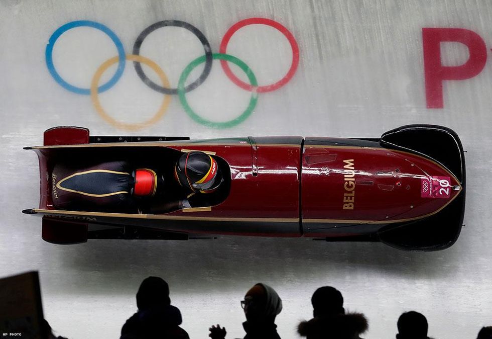 Driver An Vannieuwenhuyse and out Olympian Sophie Vercruyssen of Belgium take a curve in their first heat during the women's two-man bobsled competition