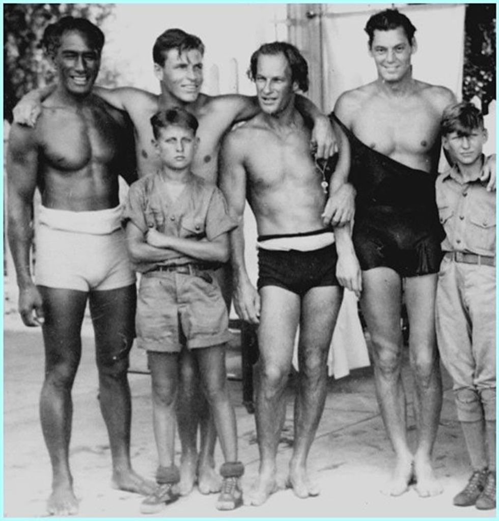 Duke Kahanamoku (far left) with Johnny Weissmuller (far right), undated