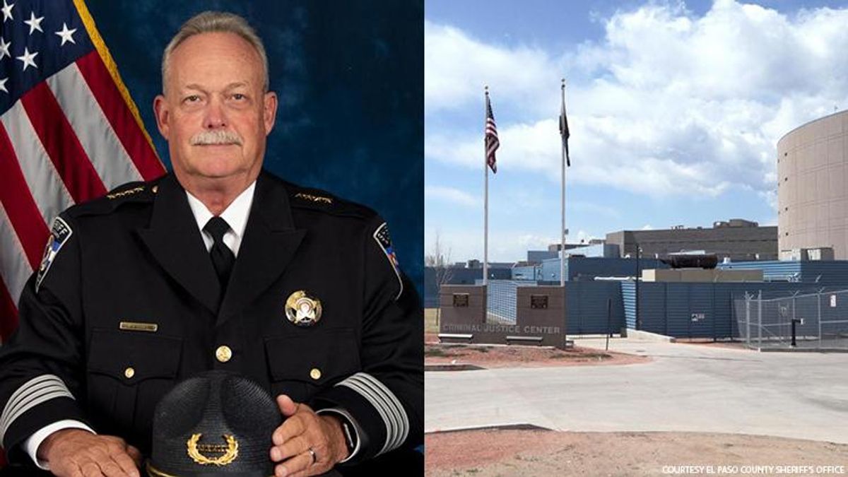 El Paso County Colorado Sheriff Bill Elder next to a photograph of the local jail.