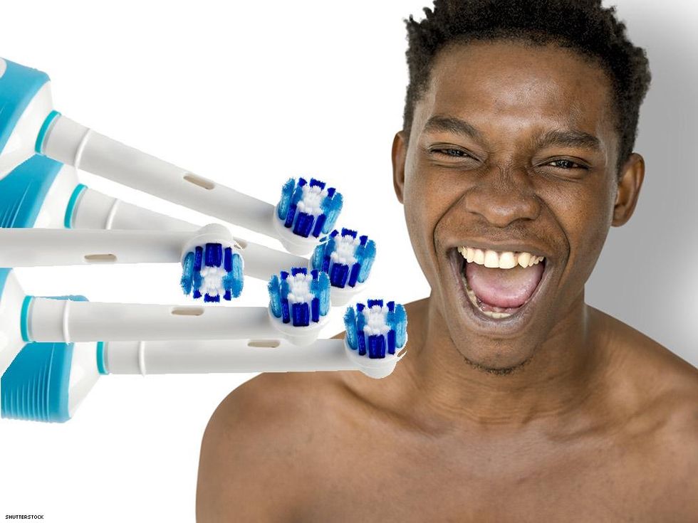 electric toothbrush heads and a smiling man
