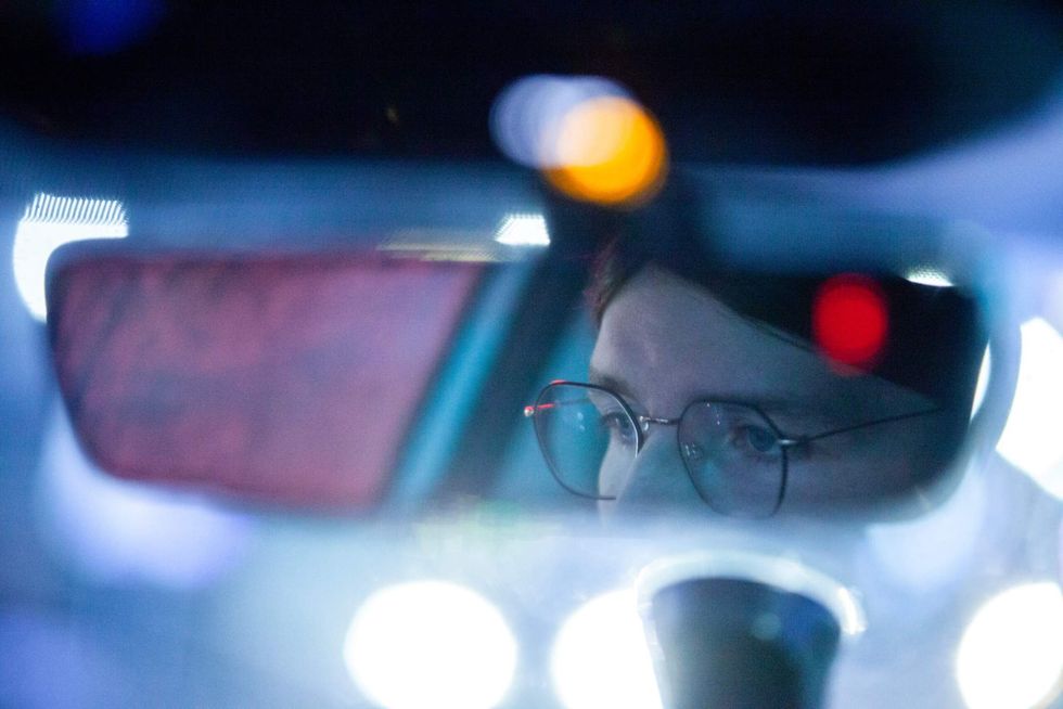 Elle Neubauer drives with Patty O\u2019Keefe through South Minneapolis on an early morning watch, looking for ICE vehicles to follow and observe Friday, Jan. 9, 2026.