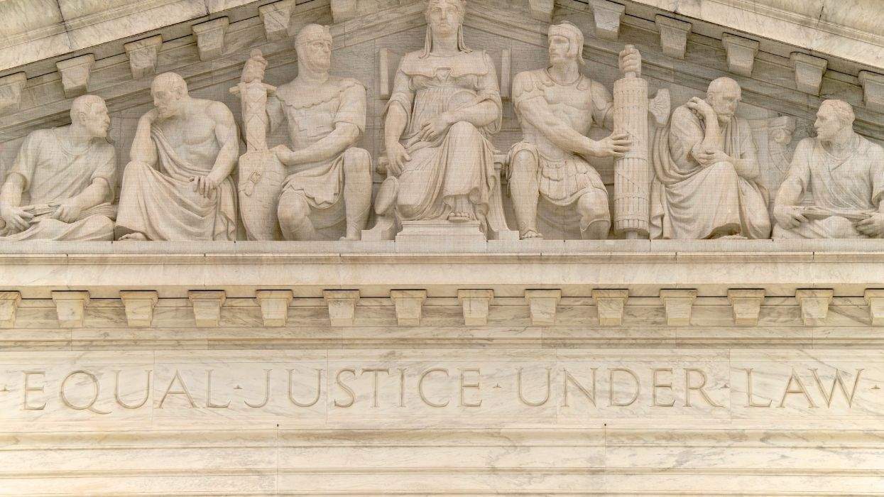 equal justice under law written in marble on the side of a building