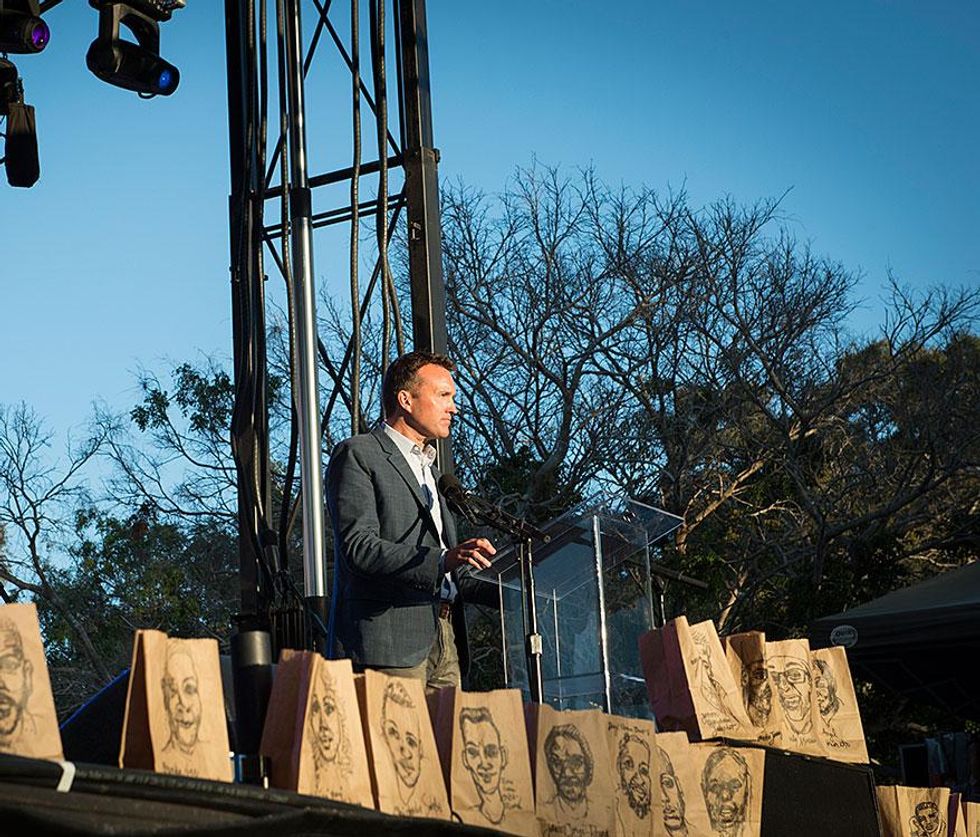 Eric Fanning speaks at the 41st San Diego Pride celebration with a tribute to the victims of Orlando in front of the podium.