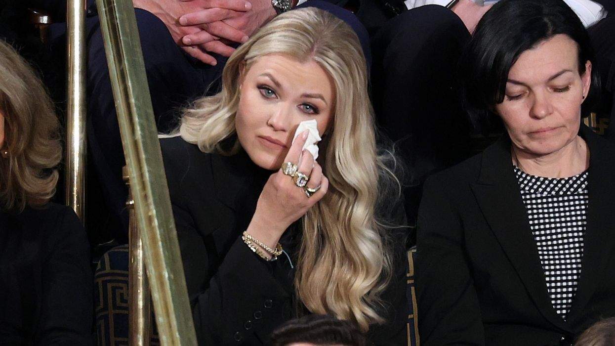 erika kirk blots her face with a tissue while sitting in the house gallery during the state of the union