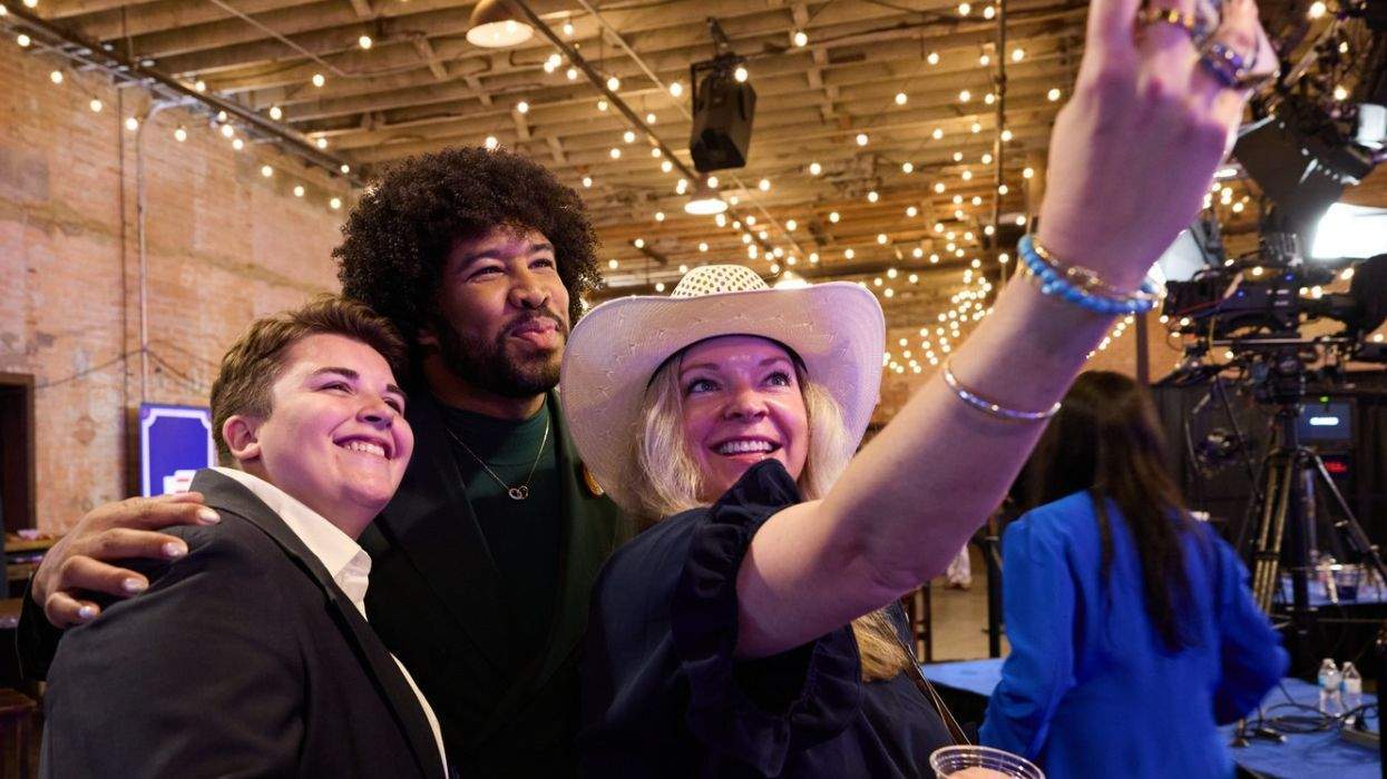 eugene daniels with two people taking a selfie