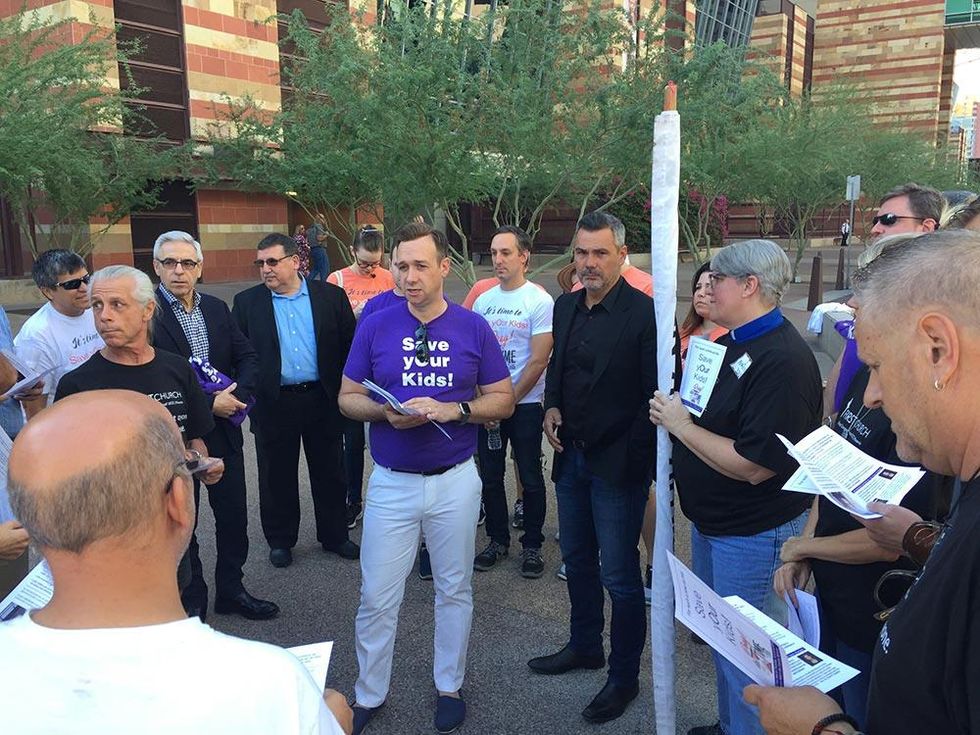Faith in America Interim executive director Robert Hoffman preps the coalition before a morning canvass shift begins.