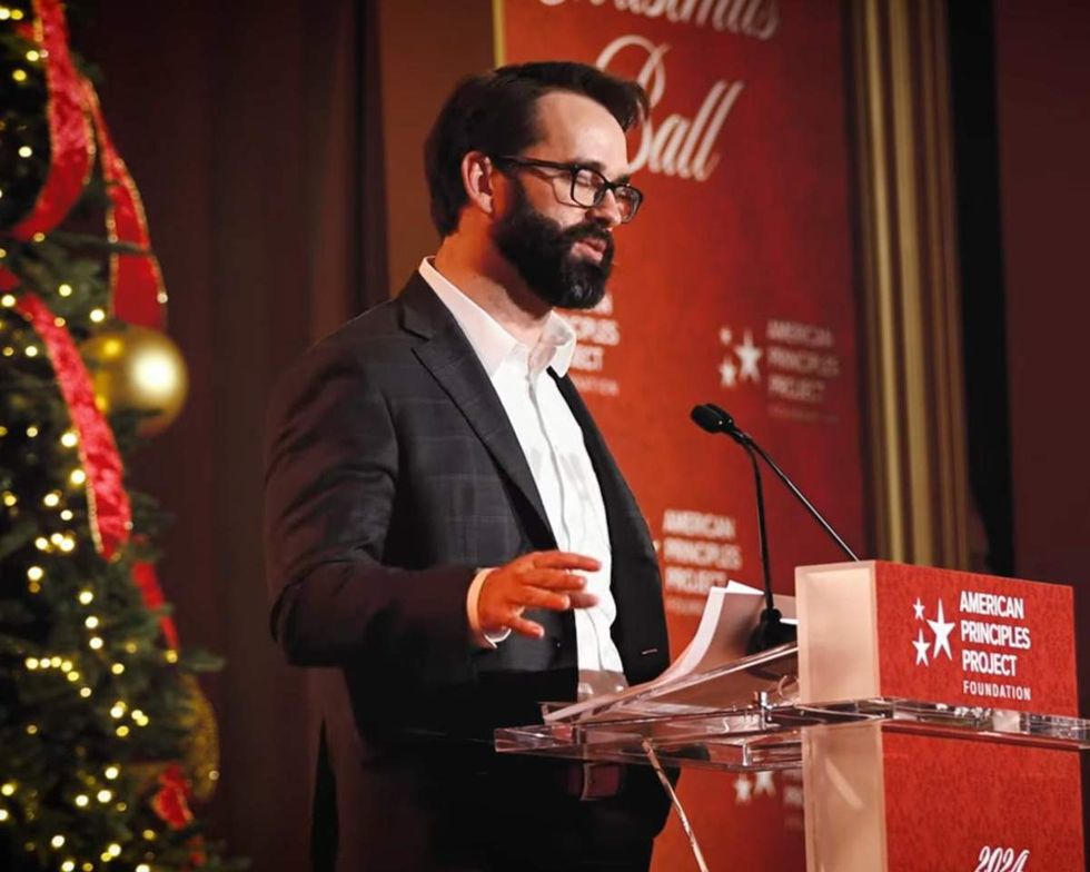 Far-right influencer Matt Walsh speaking at an APP Christmas event