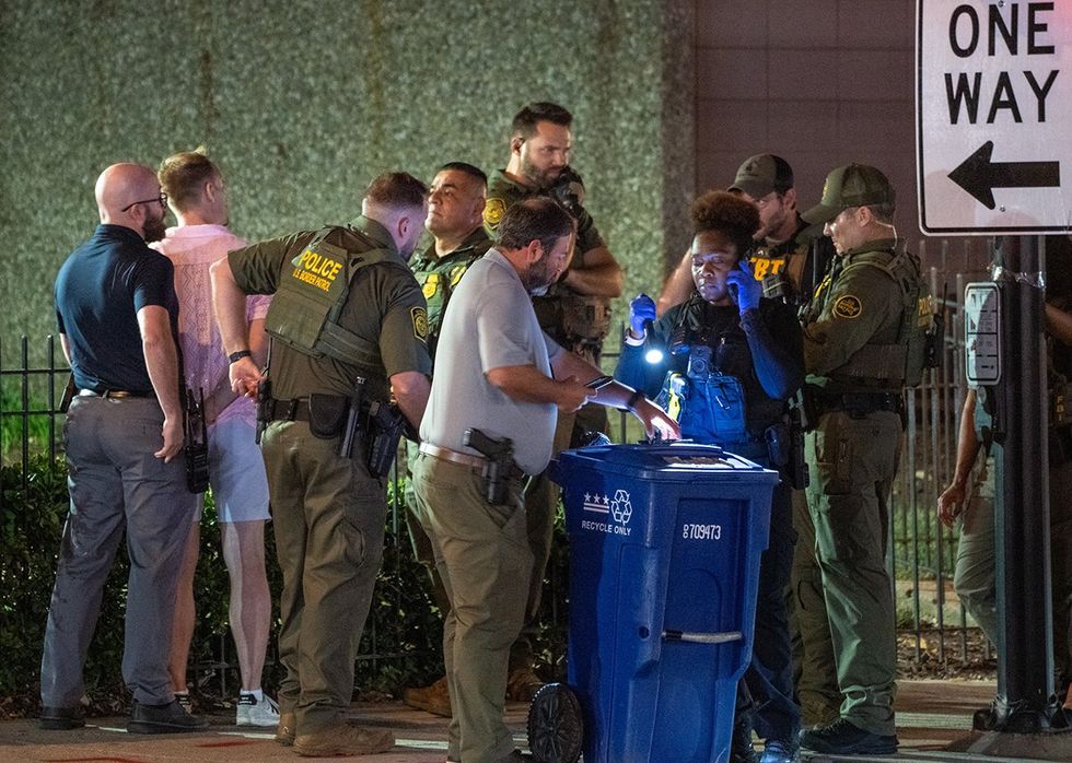 FBI and Border Patrol officers arrest a man along the U Street corridor