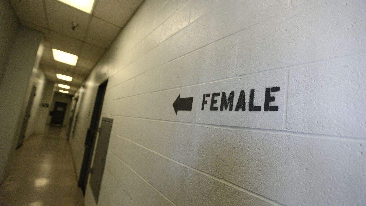 female written on a wall with an arrow