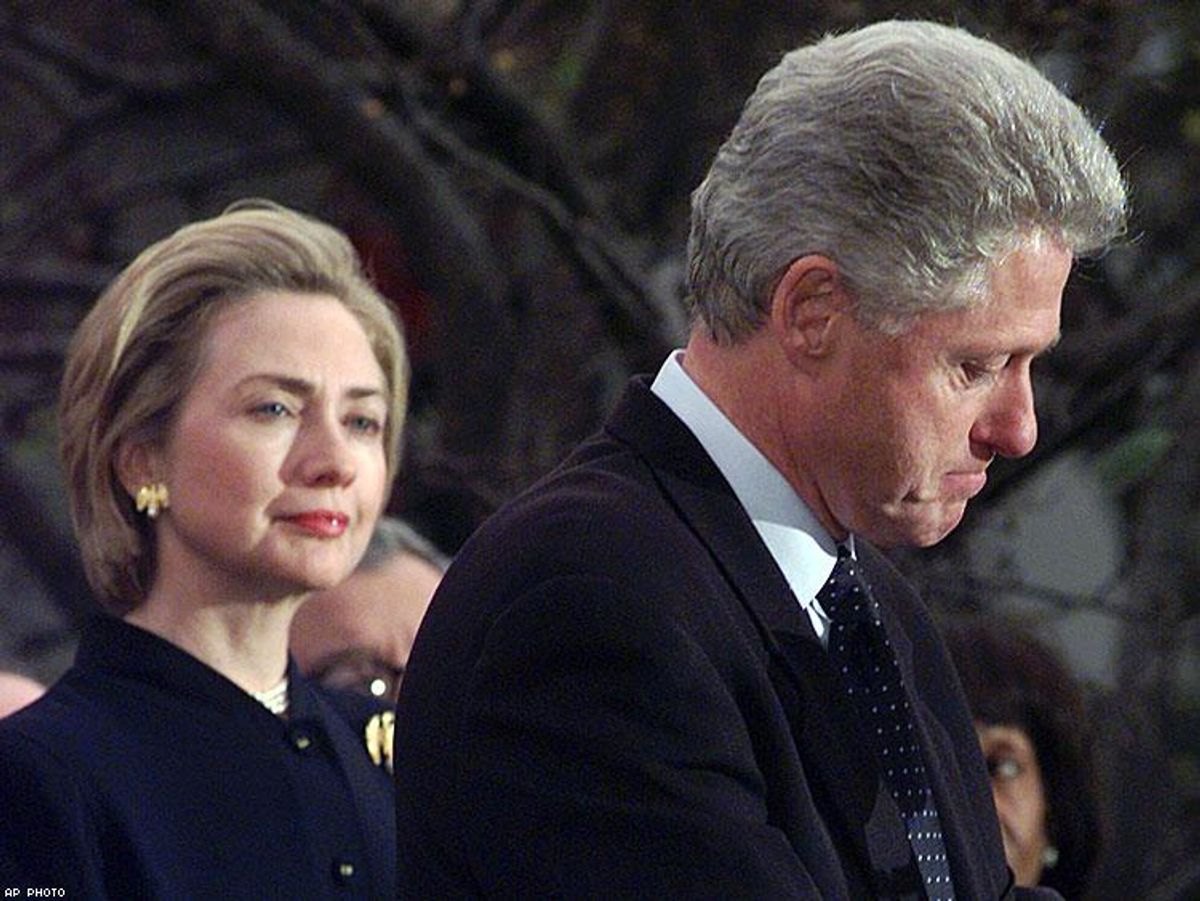 First lady Hillary Clinton watches President Clinton pause as he thanks those Democratic members of the House of Representatives who voted against impeachment in 1998.