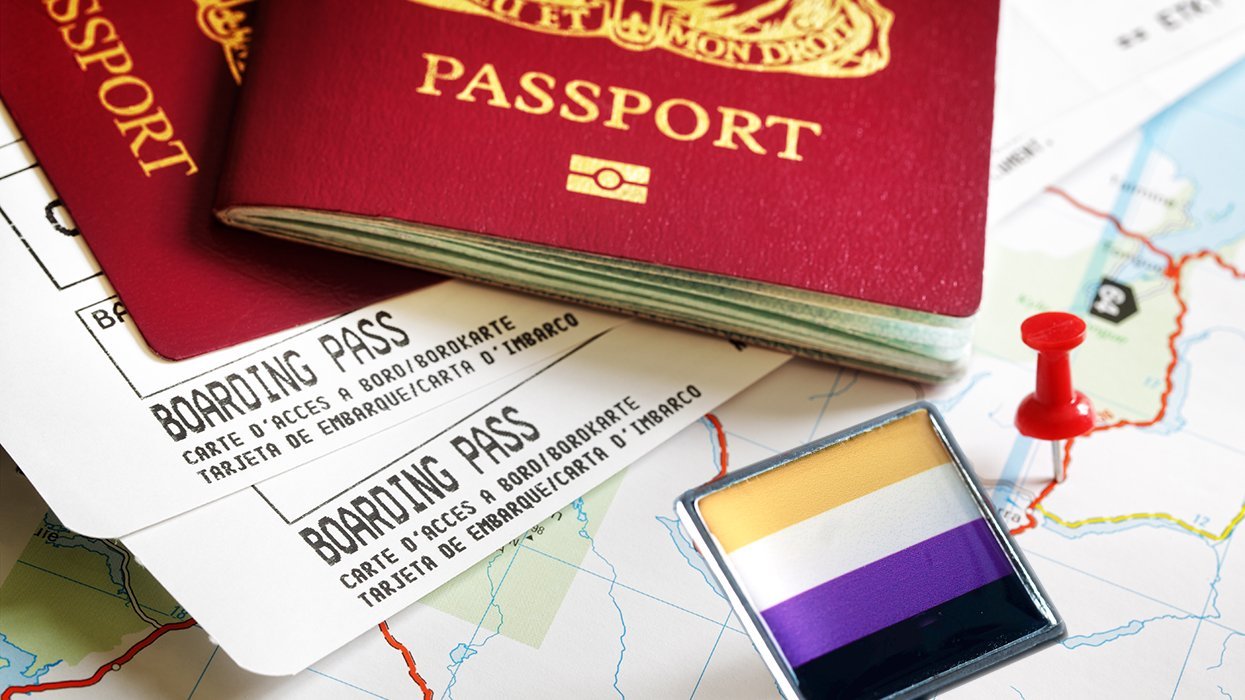 foreign passport boarding passes map with pins nonbinary flag colors