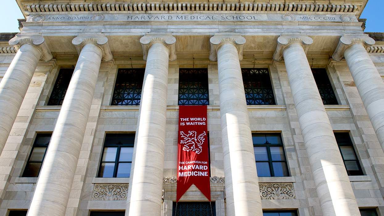 Front View of Gordon Hall at the Quadrangle Harvard Medical School building pillars and banner