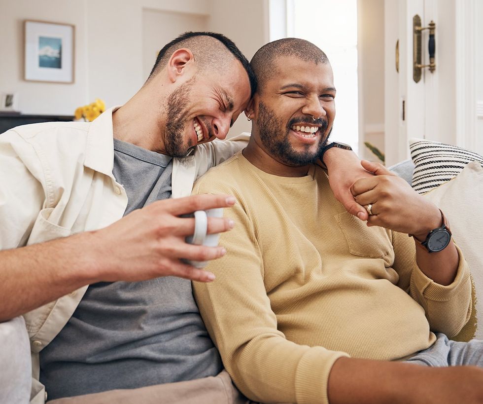 gay couple couch cuddle