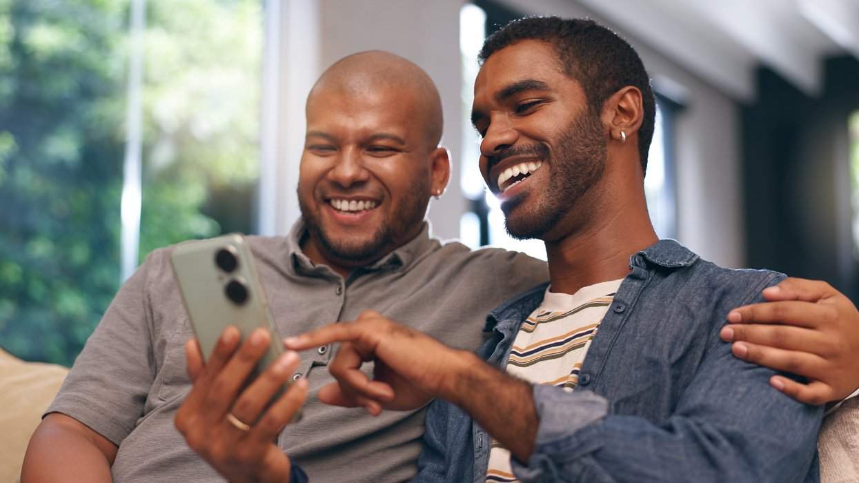 gay couple looking at a smart phone