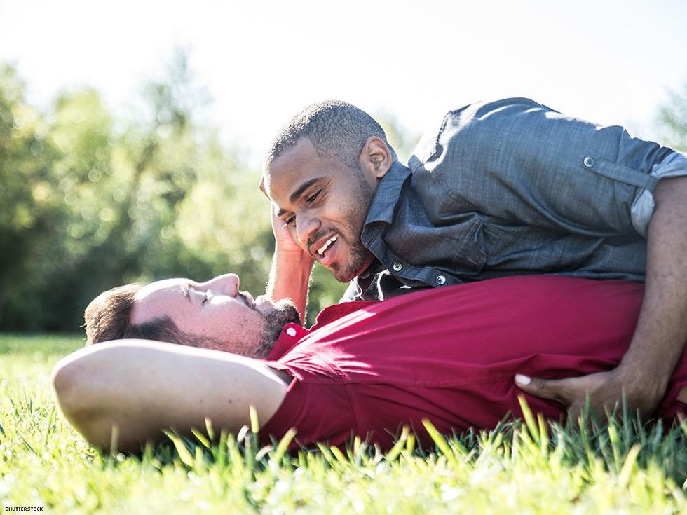 gay men laying in grass