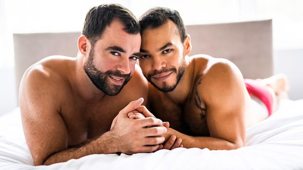 gay men queer couple enjoying decriminalized same sex life in bed with less HIV in the world